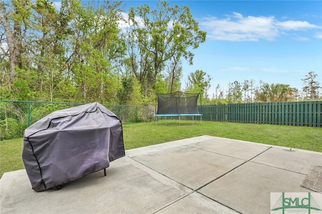 view of patio / terrace featuring a trampoline and grilling area