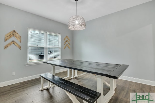 dining area with dark hardwood / wood-style floors