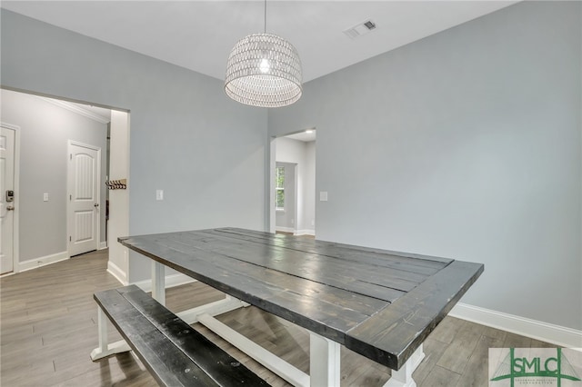 dining space featuring a chandelier and hardwood / wood-style floors