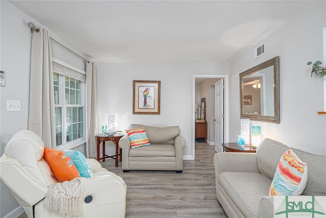 living room with light hardwood / wood-style floors