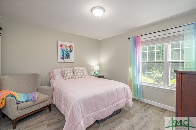 bedroom with light wood-type flooring