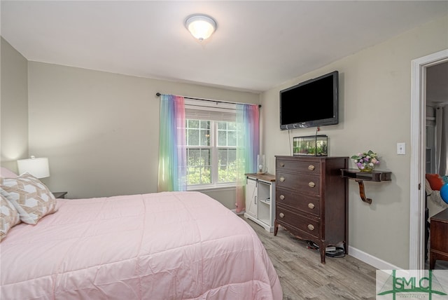 bedroom with light wood-type flooring