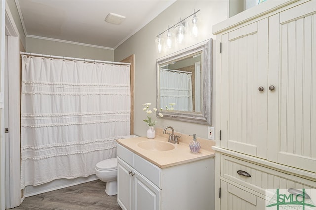 bathroom with vanity, crown molding, hardwood / wood-style flooring, toilet, and a shower with curtain