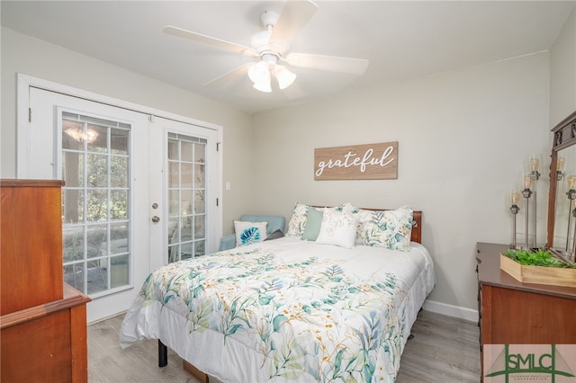 bedroom with light hardwood / wood-style floors, ceiling fan, french doors, and access to exterior