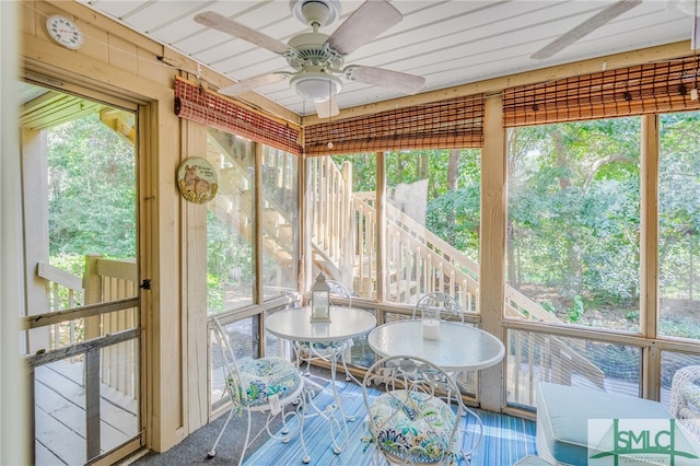 sunroom / solarium with ceiling fan