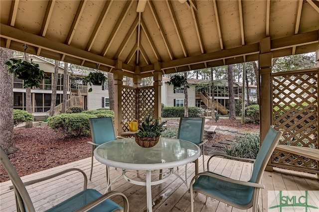 sunroom featuring lofted ceiling