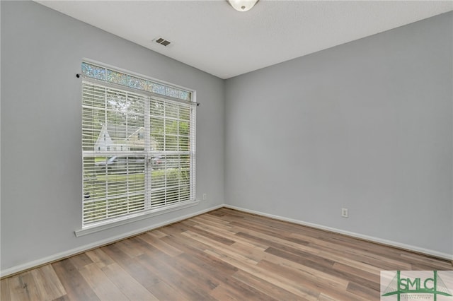 empty room featuring hardwood / wood-style floors