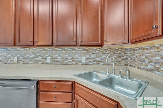 kitchen featuring dishwasher, tasteful backsplash, and sink