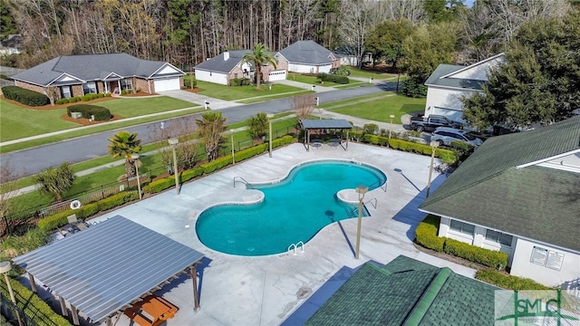 view of swimming pool featuring a patio and a gazebo