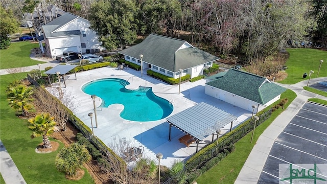 view of pool with a yard and a patio