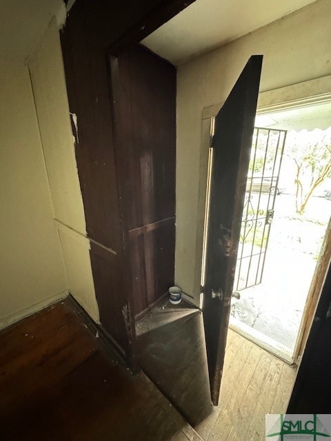 doorway to outside with wood-type flooring