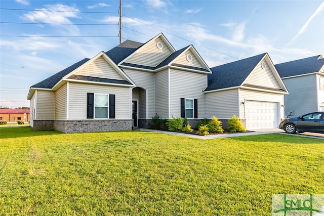 view of front of house with a garage and a front lawn