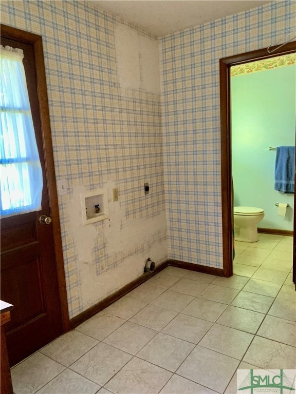 bathroom featuring vanity, tile patterned flooring, and toilet