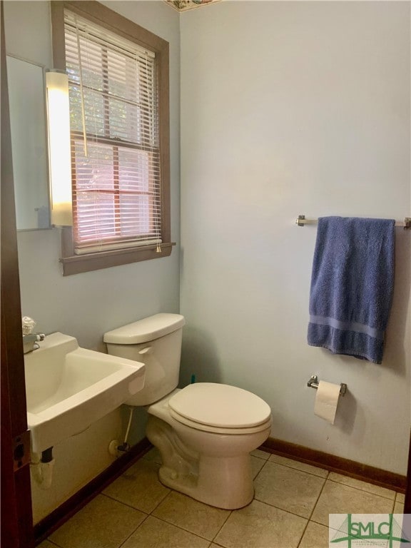 bathroom featuring tile patterned flooring and toilet