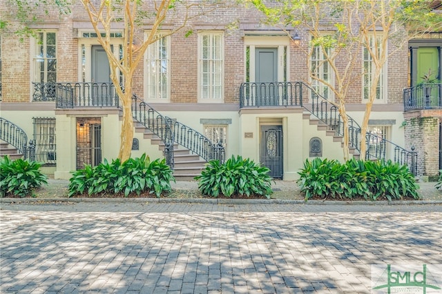 view of front of house featuring a balcony