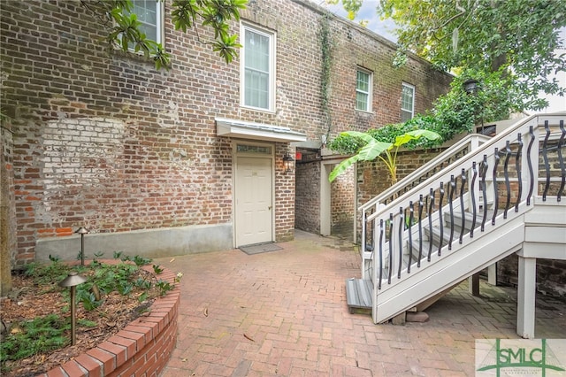 doorway to property with a patio