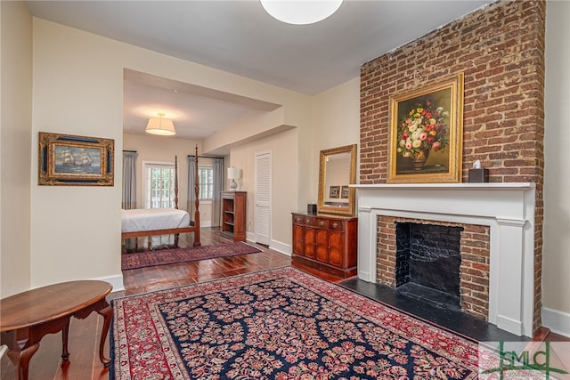 living room featuring a fireplace and hardwood / wood-style flooring