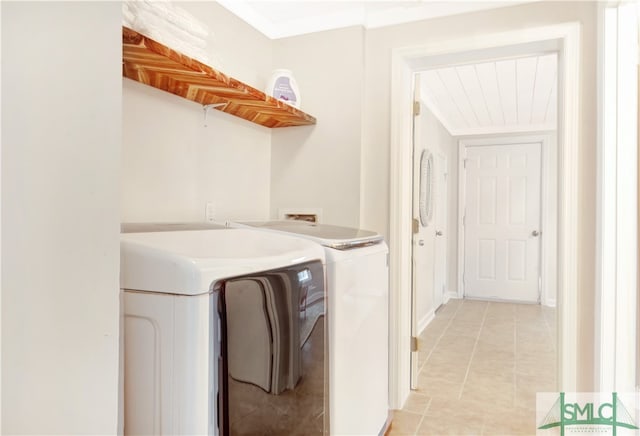 clothes washing area with separate washer and dryer