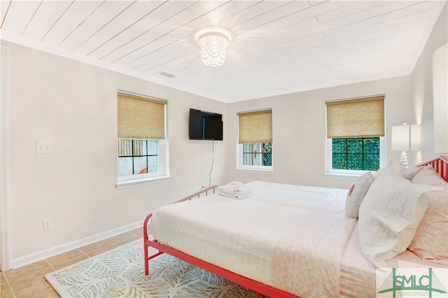 bedroom with light tile patterned floors