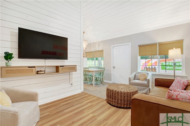 living room featuring wood walls and hardwood / wood-style flooring