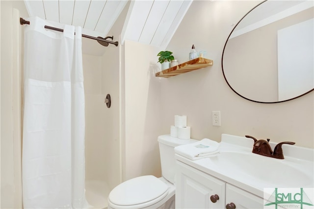 bathroom with a shower with curtain, toilet, vanity, and vaulted ceiling