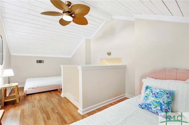 bedroom with ceiling fan, lofted ceiling with beams, wood ceiling, and light hardwood / wood-style flooring