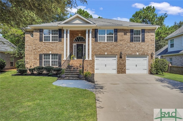 raised ranch with a front yard and a garage