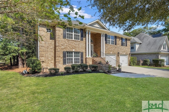 split foyer home featuring a garage and a front yard