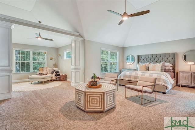 bedroom featuring carpet floors, high vaulted ceiling, ceiling fan, and ornate columns