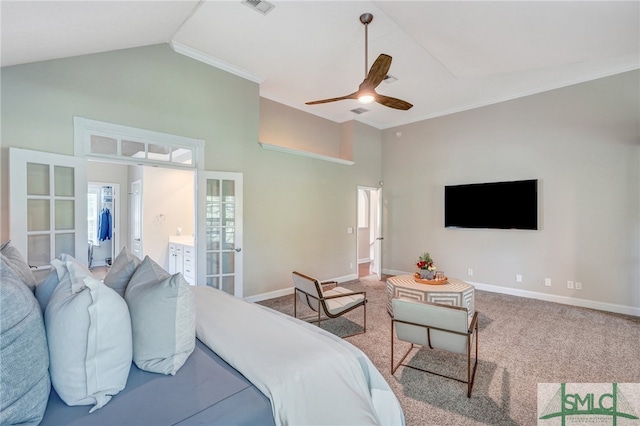 carpeted bedroom featuring high vaulted ceiling, connected bathroom, ceiling fan, french doors, and ornamental molding