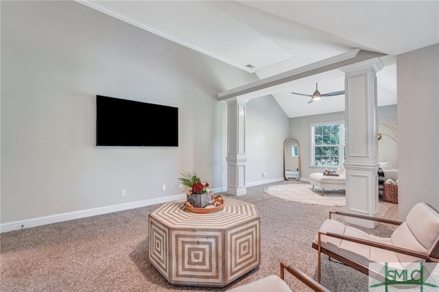 carpeted living room featuring vaulted ceiling, ceiling fan, and ornate columns