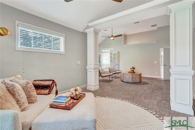 carpeted living room with lofted ceiling, ceiling fan, and ornate columns