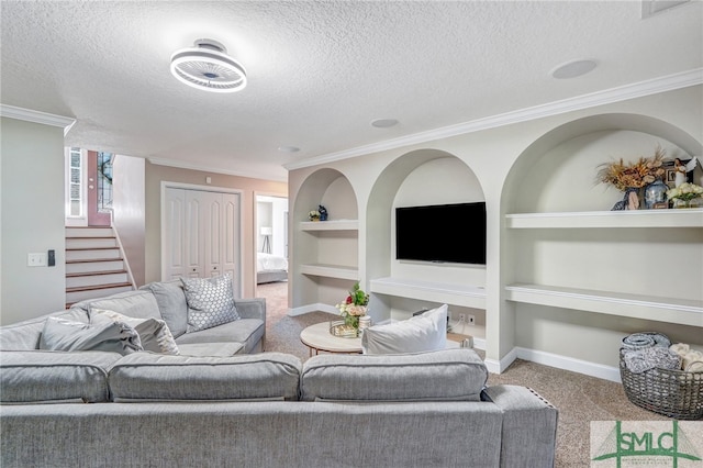 living room featuring light colored carpet, a textured ceiling, crown molding, and built in features