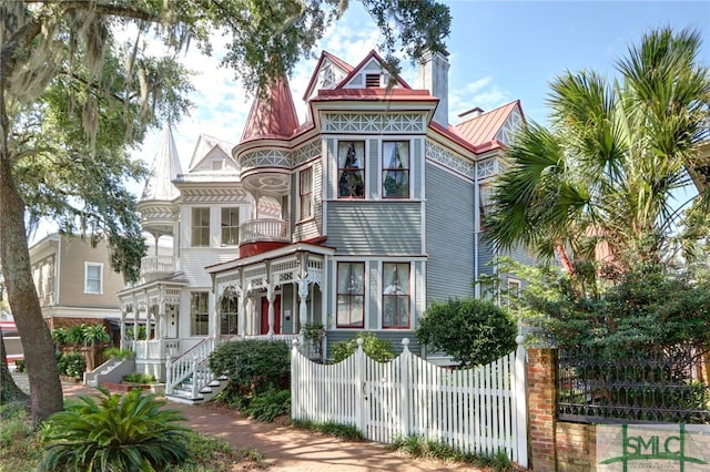 victorian-style house featuring a porch