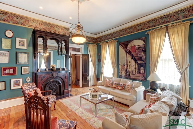 sitting room featuring crown molding and hardwood / wood-style floors