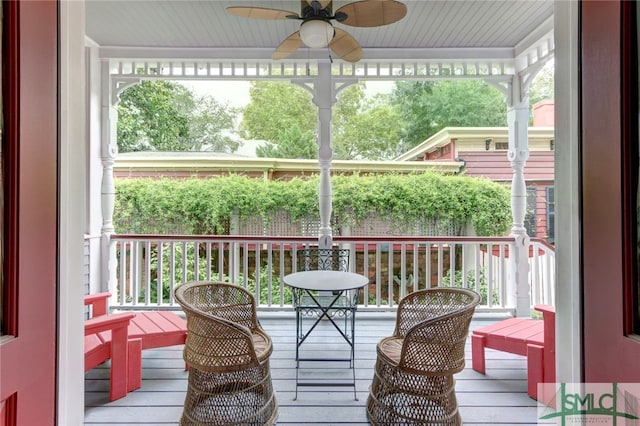 sunroom / solarium with a wealth of natural light and ceiling fan