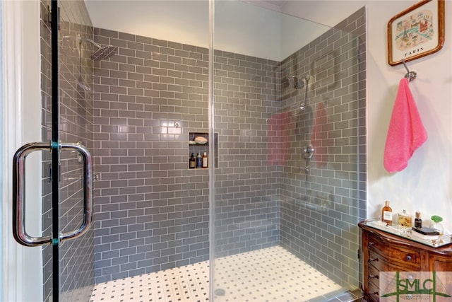 bathroom with a shower with door