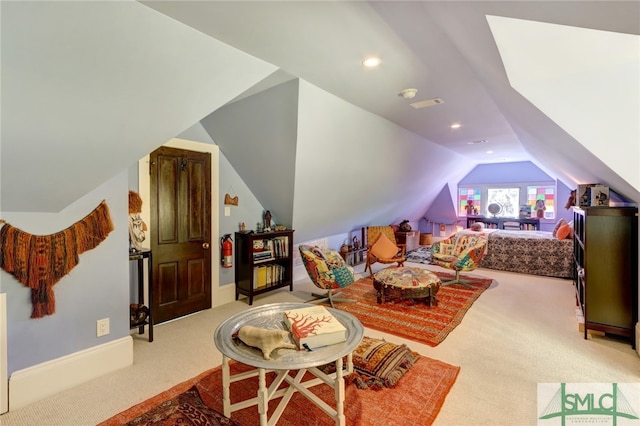 interior space with light colored carpet and lofted ceiling