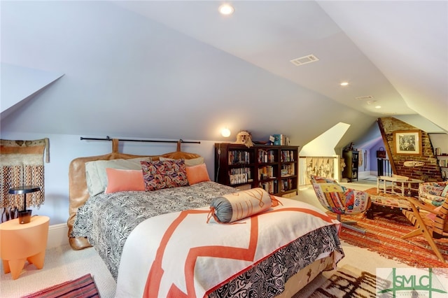 carpeted bedroom featuring lofted ceiling