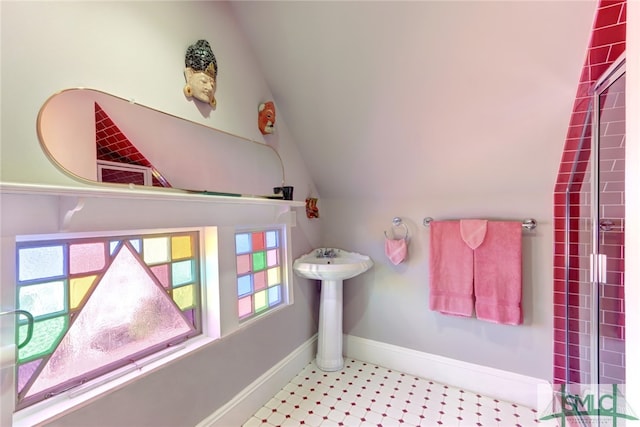 bathroom featuring vaulted ceiling