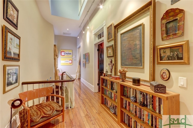 corridor featuring light hardwood / wood-style floors