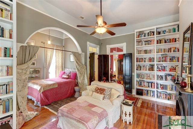 bedroom with ceiling fan and hardwood / wood-style floors