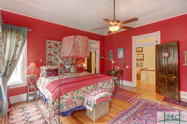 bedroom featuring wood-type flooring and ceiling fan