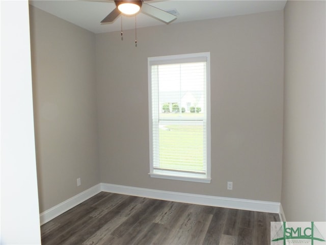 unfurnished room with dark wood-type flooring and ceiling fan