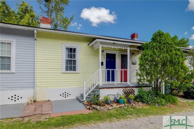 view of front of property featuring a chimney