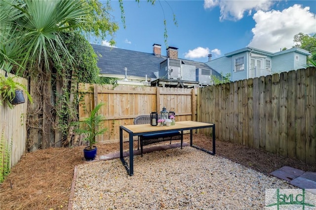 view of yard with a fenced backyard and a patio