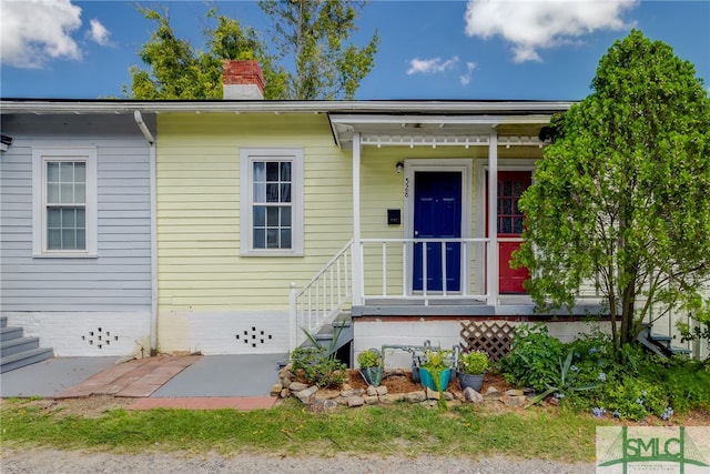 view of front of home with a chimney