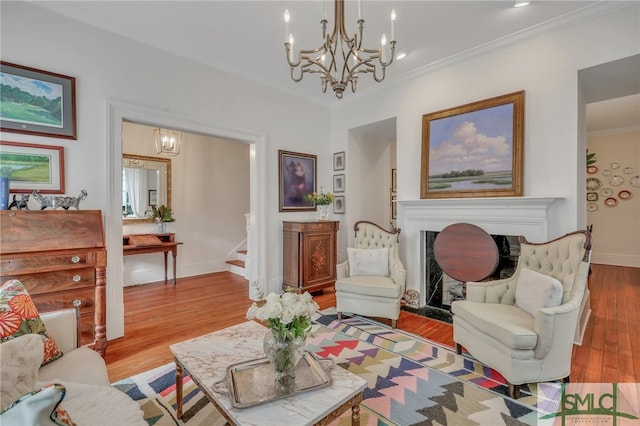 living room featuring crown molding and light hardwood / wood-style floors