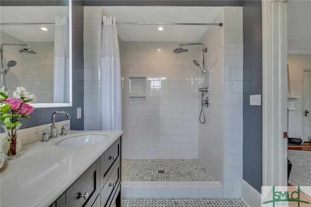 bathroom featuring tile patterned flooring, vanity, and a shower with curtain