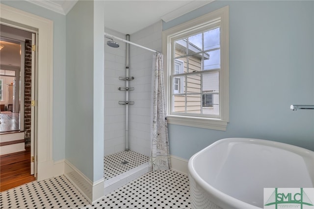 bathroom featuring ornamental molding, plus walk in shower, and tile patterned flooring